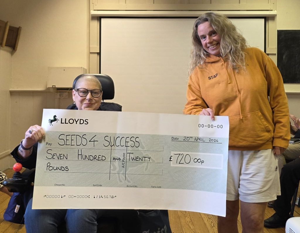 Cllr Boyd presenting a cheque to Jaki from Seeds4Success for £720